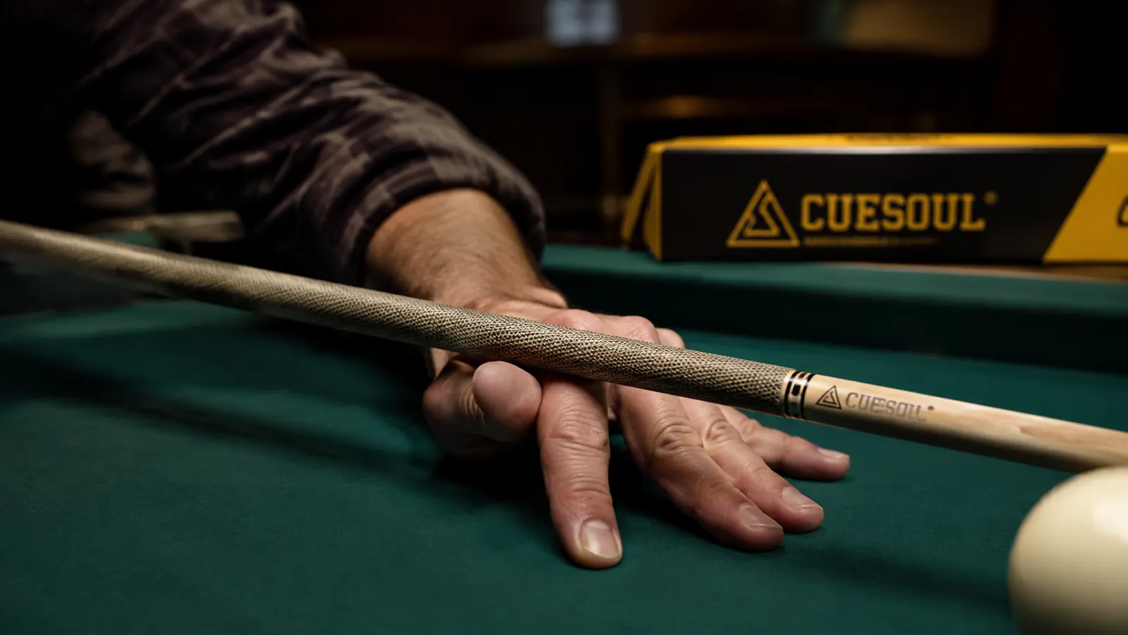 Hand gripping the Irish linen wrap of a CUESOUL Rockin Series cue before a shot