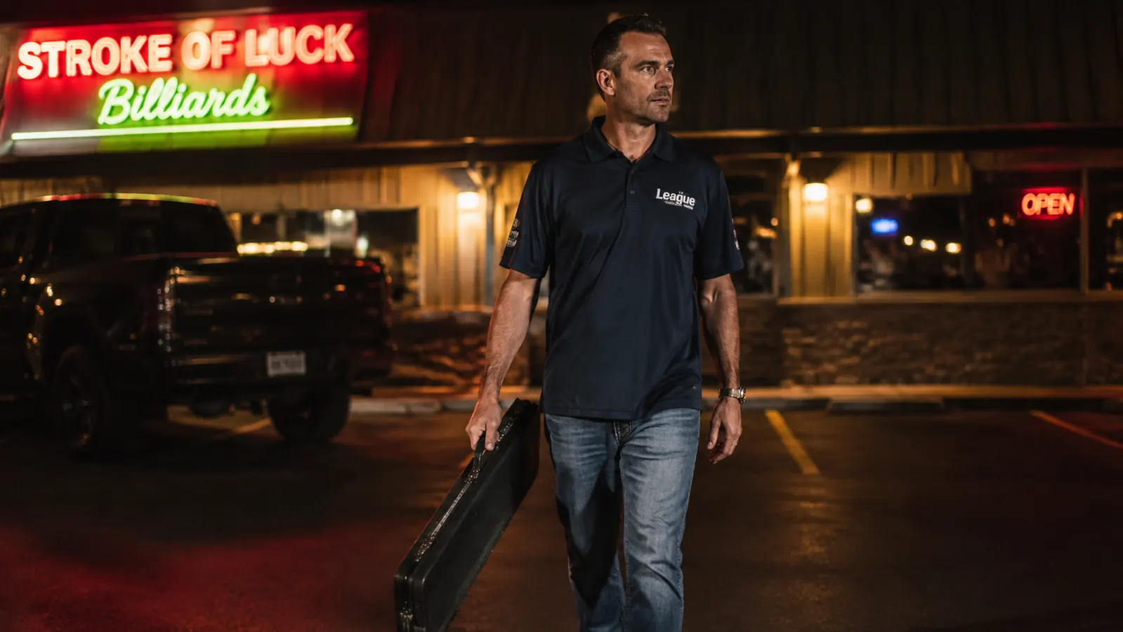 Pool player walking through a parking lot carrying the Q-Vault Supreme by its handle