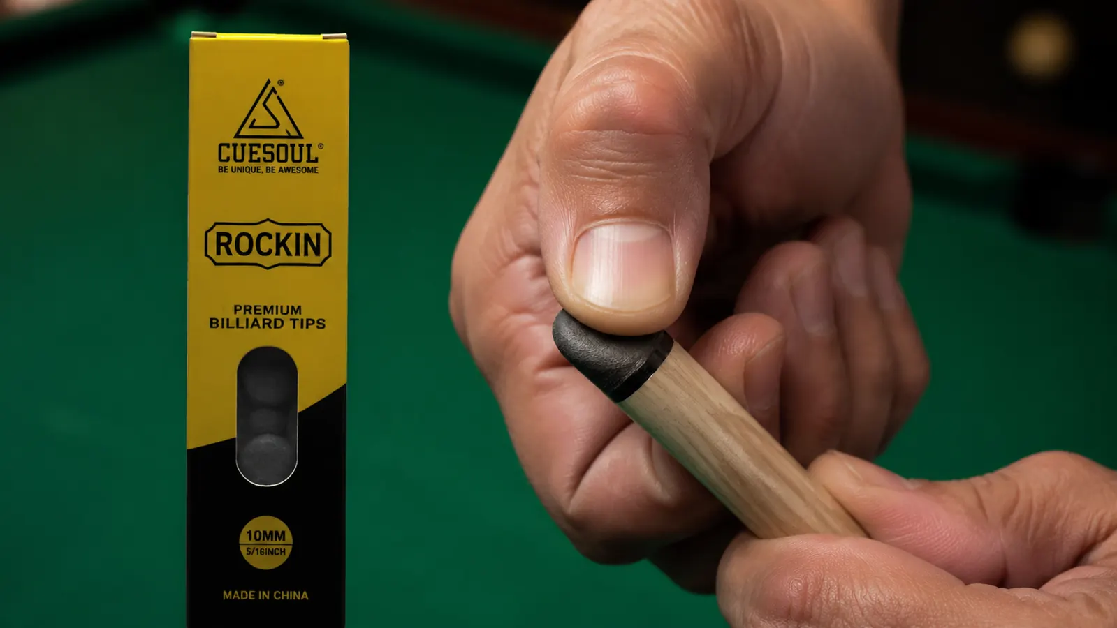 Close-up of a pool cue tip being pressed with a thumbnail to test hardness