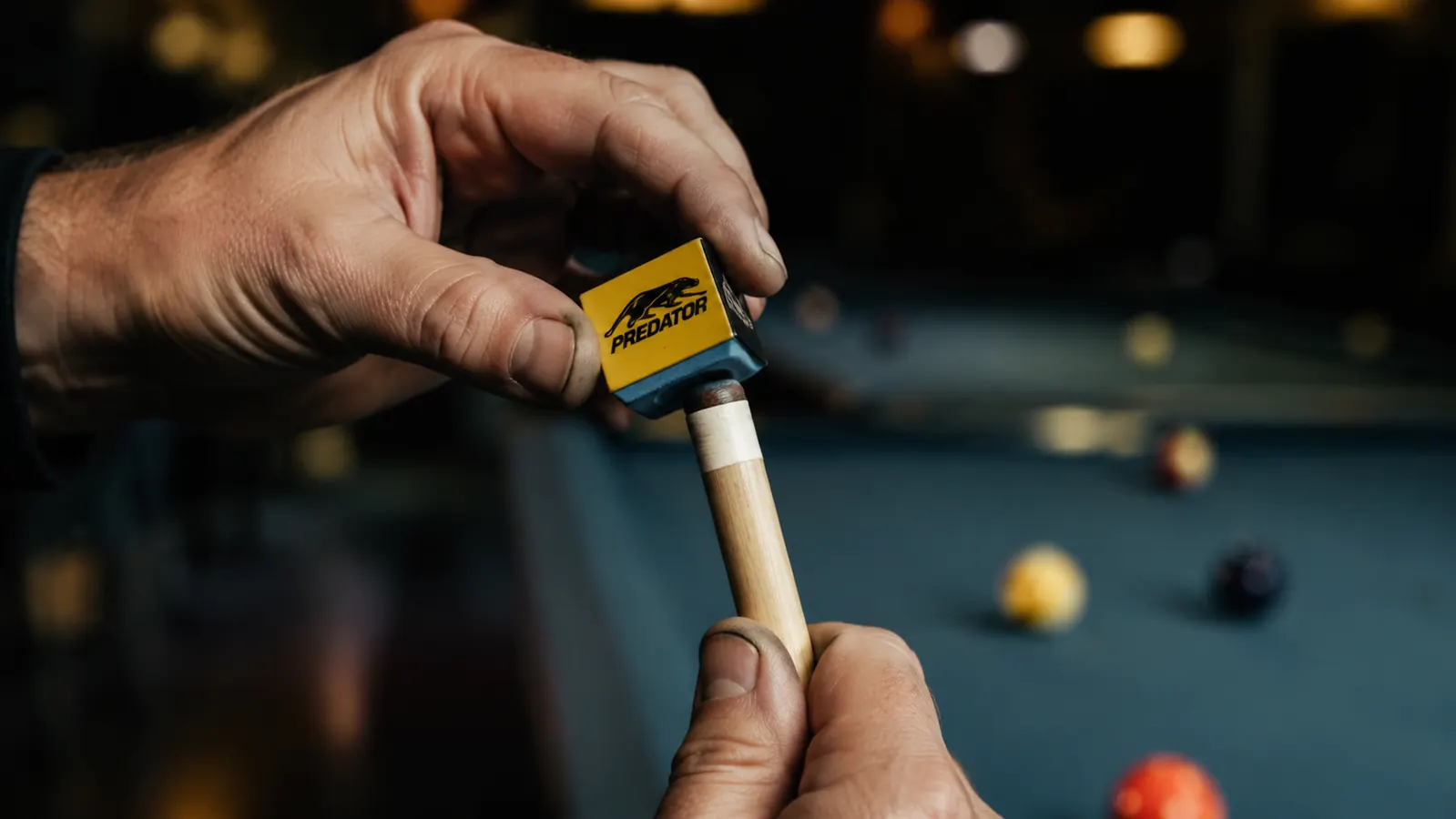 Proper chalking technique showing the brush stroke motion across the cue tip