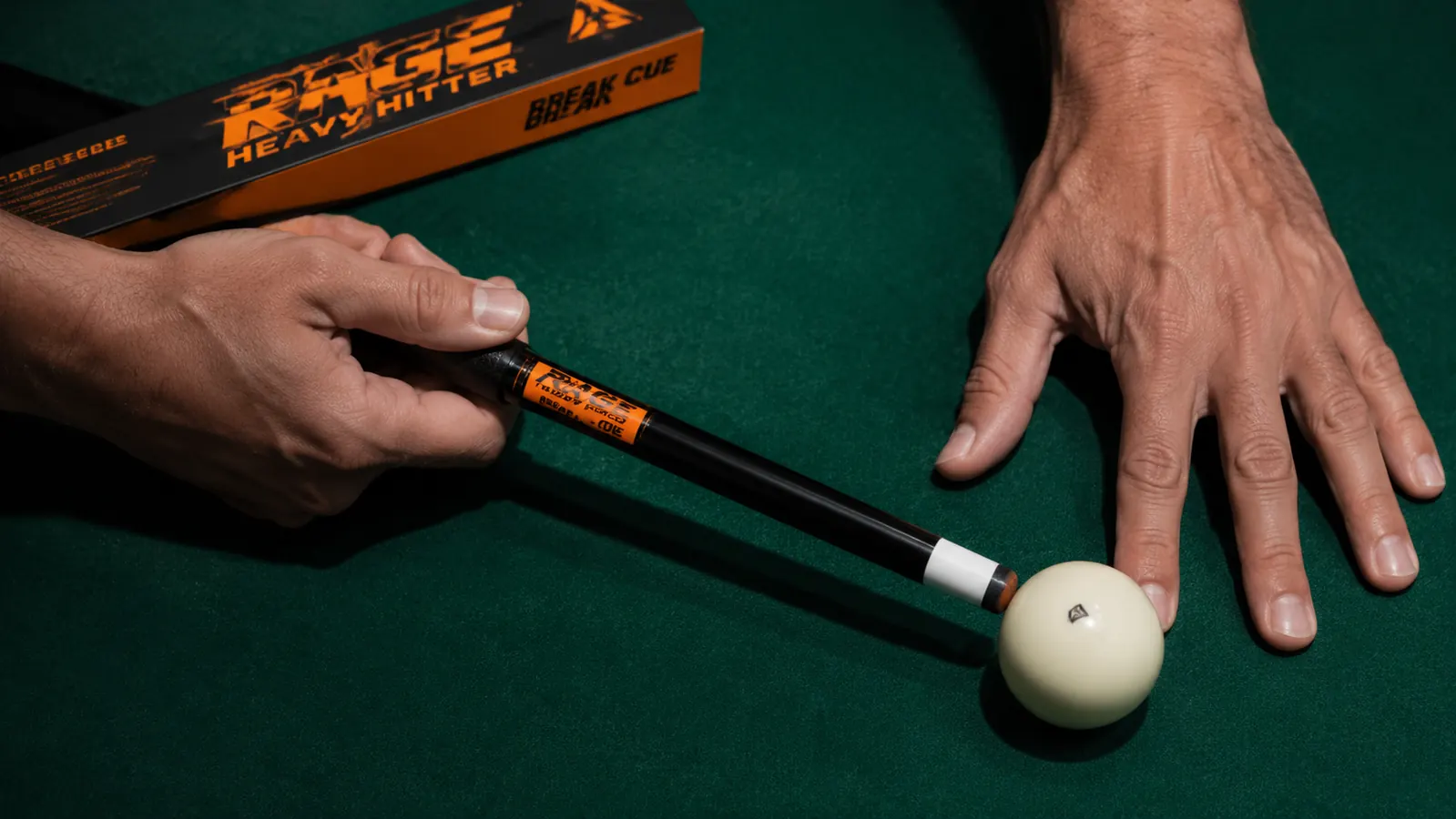 Overhead view of the RAGE Heavy Hitter phenolic tip pressed against a white cue ball at the moment of a break shot